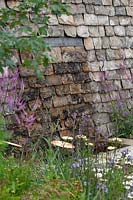 Contemporary planting set against a traditional Cotswold stone wall in Cotswold Connections - RHS Tatton Flower Show 2016