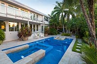 Swimming pool in tropical garden. The Jones Residence, Key West, Florida, USA. Garden design by Craig Reynolds.
