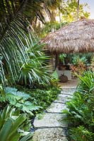 The chickee hut in tropical garden. The Jones Residence, Key West, Florida, USA. Garden design by Craig Reynolds.
