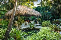 The chickee hut in tropical garden. The Jones Residence, Key West, Florida, USA. Garden design by Craig Reynolds.