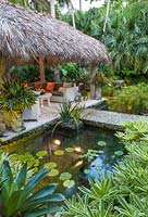 Water lilies in pond in tropical garden. The Jones Residence, Key West, Florida, USA. Garden design by Craig Reynolds.
