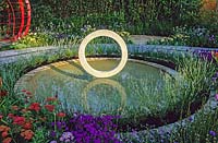 Circular sculpture in pool. Design by May and Watts. Hampton Court Flower Show, 2003