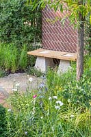 Bench topped with Scottish oak with staddle stones and brick screen, 'South Oxfordshire Landscape Garden'
