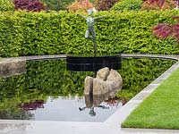 'The Leaf Creative Garden: A Garden of Quiet Contemplation' - pond with  
sculpture by Simon Gudgeon