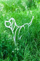 Labrador - artwork of powder-coated steel - set in long grass
