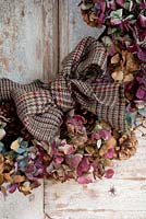 Multicoloured dried Hydrangea wreath with tartan bow