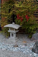 Stone lantern in rock garden in Japanese-themed garden. 