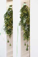 Festive decorations made from Eucalyptus, Juniperus and Cucurbita.