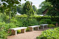 Stone benches in restored Rose garden of the Koenigliche Gartenakademie Berlin, Germany. 