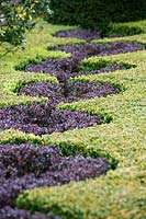 Detail of the knot garden with Buxus and Berberis. Abbey House Gardens, Malmesbury, UK. 