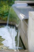 Close up of fountain in modern, water feature. 