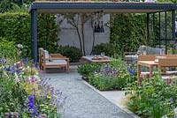 A contemporary garden with nectar rich planting, a green roof, trees and outdoor rooms