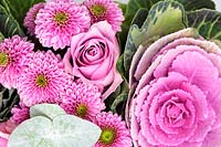 Flower spray of Chrysanthemum pink pompons, Kale, Ornamental cabbage, rose buds