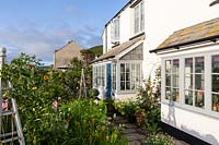 The Old Stone Cottage, Beesands, South Devon. The front garden of seaside cottage garden.