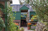 Garden Cottage at Gunwalloe in Cornwall.  Cottage garden in autumn. The potting shed.