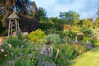 Large double Large summer borders overflowing with summer planting at Miserden Park, Gloucestershire