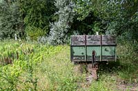 Old trailer in a garden.