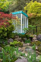 Outdoor shower overlooking a water pool surrounded by Acer palmatum, moss balls and Iris 'Shirley Pope' - Green Switch, RHS Chelsea Flower Show 2019