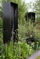 Viking Cruises: The Art of Viking Garden, planting in front of the black metal sculptures includes Valeriana officinalis and Salix. Sponsor: Viking.