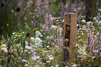 Insect or bug hotel amongst naturalistic planting