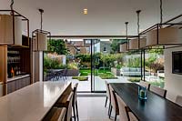 View through kitchen and sliding glass doors towards garden 
