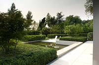 Contemporary pool in modern garden. 