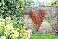 A woven Salix - Willow - heart on a gate 