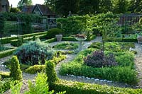 View of formal walled vegetable and fruit garden, with herb parterre at the centre