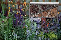 Bug hotel set amongst colourful perennials in the 'Split Screen' garden at BBC Gardenerer's World Live 2017