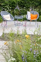Seating area with two armchairs and planting of nectar-rich flowers - The Urban Pollinator Garden, Designed by Caitlin McLaughlin RHS Hampton Court Palace Garden Festival, 2019 