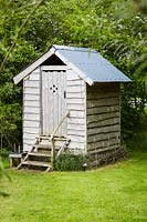 Wooden shed with toilet and shower facilities 
