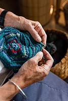 Alison Ellen Hand Knits studio - Alison knitting a hat