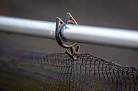 Detail of clip used to secure netting on frame