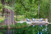 Relaxing area by the water in Mill Creek Ranch in Vanderpool, Texas designed by Ten Eyck Landscape Inc, July.