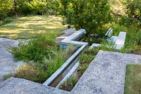 Concrete water feature at Mill Creek ranch in Vanderpool, Texas designed by Ten Eyck Landscape Inc, July.