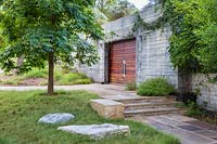 Pathways and steps leading to entrance doors at Mill Creek Ranch in Vanderpool, Texas designed by Ten Eyck Landscape Inc, July.