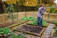 Digging over an empty bed in a vegetable garden 