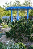 Blue rainfall pavilion with raincatchers and gravel garden. The Thames Water Flourishing Future Garden. RHS Hampton Court Palace Garden Festival, 2019.