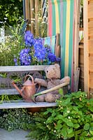 Wooden bench with teddybear - RHS Hampton Court  Palace Garden Festival, 2019.