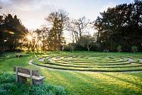 Turf maze created in the 1980s at Doddington Hall, Lincolnshire on a March evening