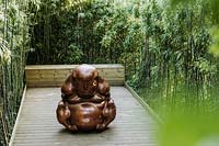 The philosopher in the posture of a Buddhist monk by Dashi Namdakov in Jardin Zen. Les Jardins d Etretat, Normandy, France