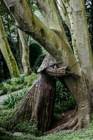 Tree hugger wicker people by Agnieszka Gradzik and Wiktor Szostalo covered in Muehlenbeckia compactus. Les Jardins d Etretat, Normandy, France