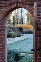 View through doorway to large Surrey garden 