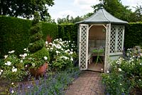 Summerhouse at the end of the rose garden at Wollerton Old Hall Garden, Shropshire.