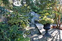 Rill garden at Chanticleer. Tropical foliage  in urns and in ground