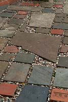 Recycled materials used to create path with shingle infill