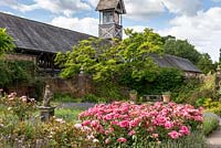 The Flag Garden and Clock Tower at Arley Hall, Cheshire, UK.
