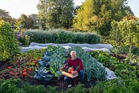 Charles Dowding with a box of vegetables from his garden at Homeacres in Somerset