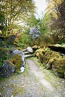 The Rockery criss-crossed by a network of pebbled paths at Hotel Endsleigh, Devon.