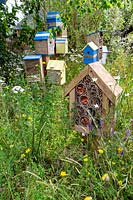 The Thames Water Flourishing Future Garden - bug hotels and bird houses in wildlife-friendly garden